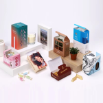 Various Custom Product Packaging Boxes Display Including Candle, Candy, Electronics, And Plant Boxes On A White Background