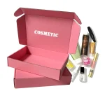 Custom cosmetic boxes: pink corrugated mailer printed with COSMETIC, displayed with skincare products