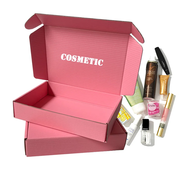 Custom cosmetic boxes: pink corrugated mailer printed with COSMETIC, displayed with skincare products