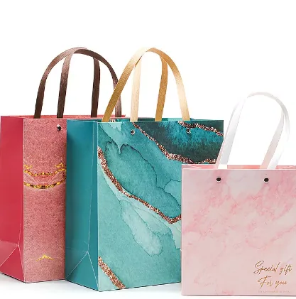 Full-color custom marble print gift paper bags with ribbon handles for wholesale retail programs