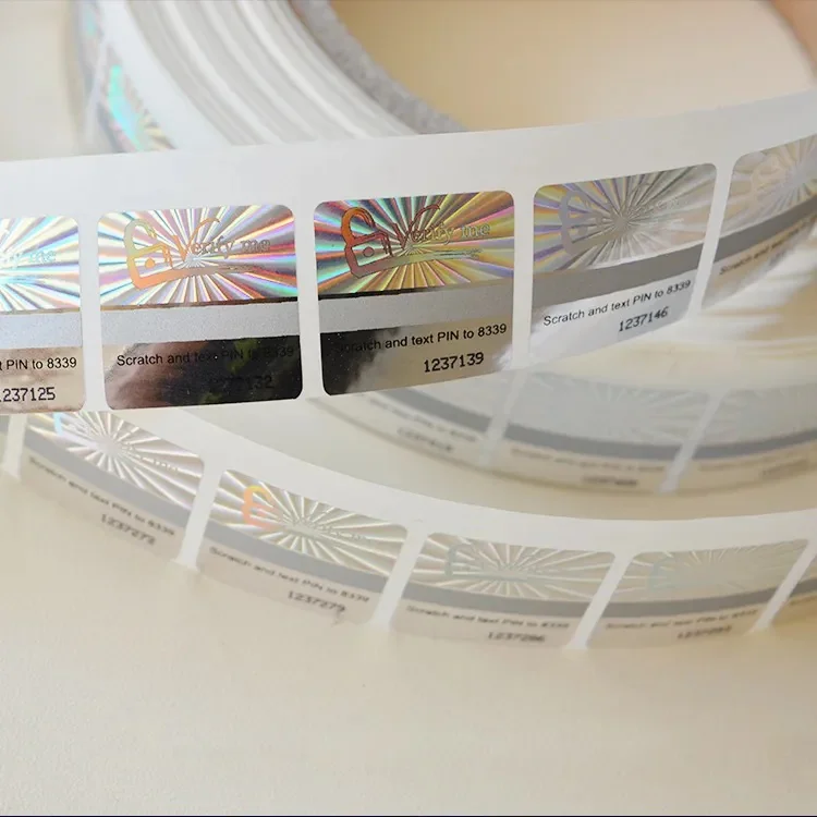 Holographic scratch-off labels with variable serial PIN on a roll Roll of holographic scratch-off security labels with unique serial PIN numbers